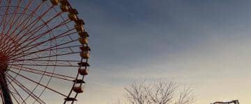 Solar eclipse over Cedar Point with Ferris wheel in foreground